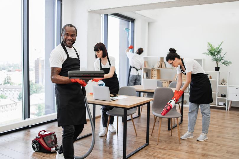 Commercial cleaners cleaning an office space