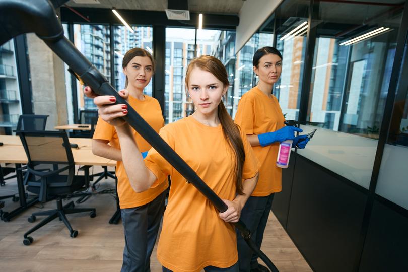 Commercial cleaners cleaning an office space