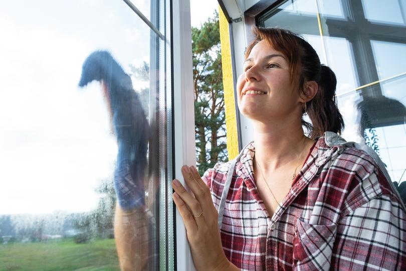 A window cleaner cleaning a high-rise building