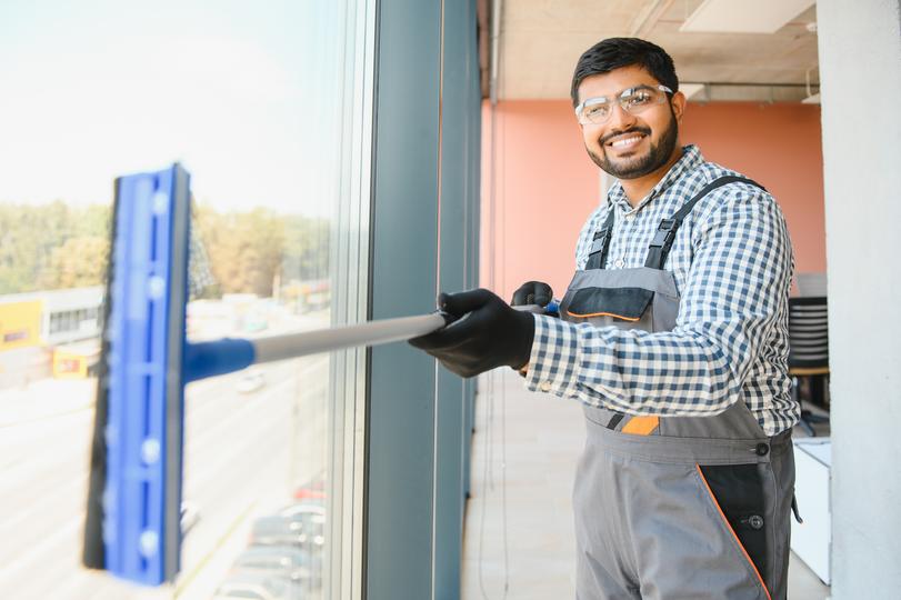 A window cleaner cleaning a high-rise building